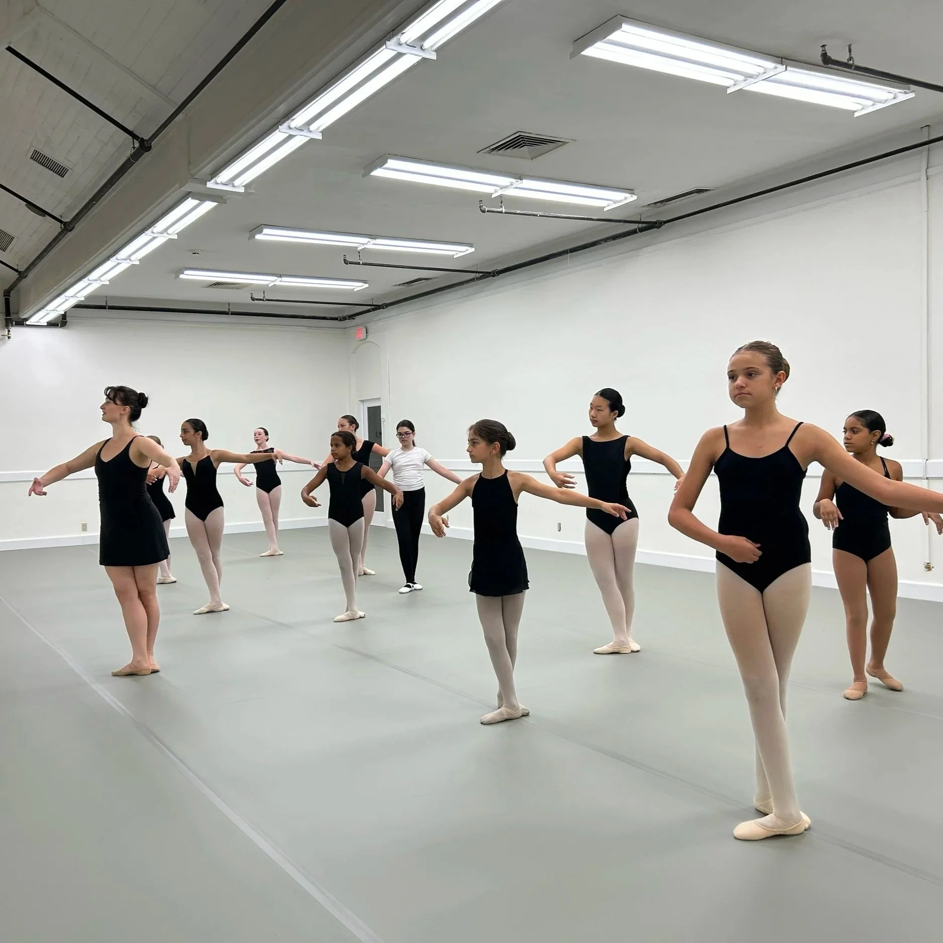 WBC dancers practicing together in a bright studio